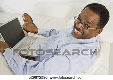 Cheerful Senior Man Using Laptop View Large Photo Image Stock Image - Cheerful Senior Man Using Laptop. Fotosearch