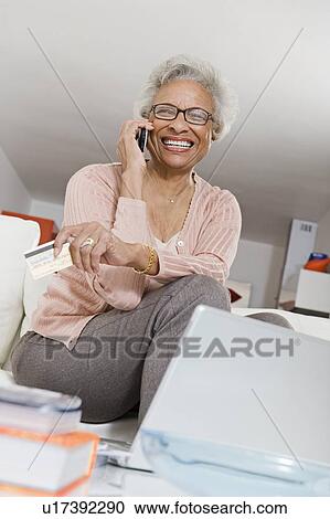 Stock Image - Cheerful Senior Woman On The Phone. Fotosearch