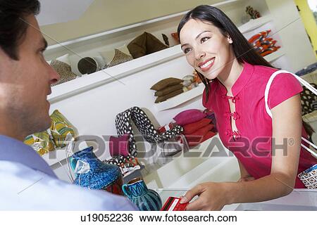 Stock Photograph - Clerk Handing Receipt to Customer. Fotosearch