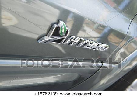 Stock Photo - Close up of sing on hybrid car. Fotosearch