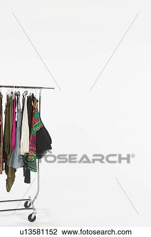 Clothes on a rail, copyspace View Large Photo Image Stock Image - Clothes on a rail, copyspace. Fotosearch
