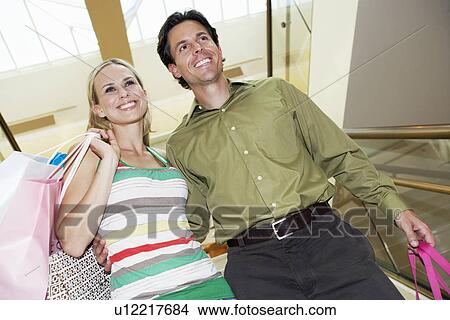 Picture - Couple Descending Stairs. Fotosearch