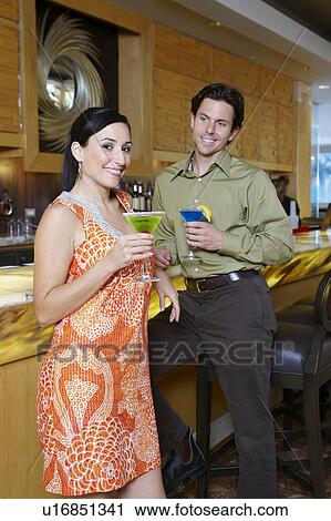 Stock Image - Couple Drinking Martinis. Fotosearch