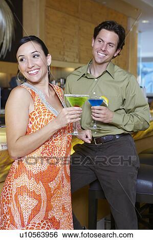 Stock Photograph - Couple Drinking Martinis. Fotosearch