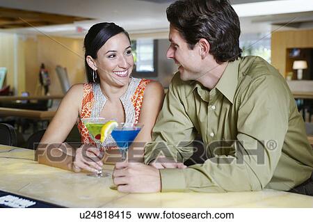 Stock Photography - Couple Drinking Martinis. Fotosearch