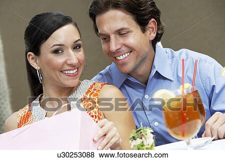 Stock Photo - Couple Sitting in a Cafe. Fotosearch