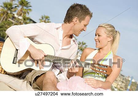 Picture - Couple with guitar. Fotosearch