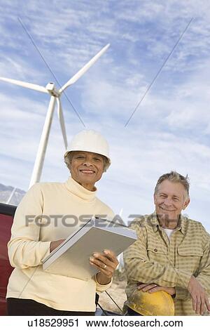 Couple working at wind farm View Large Photo Image Stock Image - Couple working at wind farm. Fotosearch