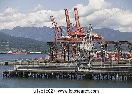 Stock Photo - Cranes on pier of Vancouver Harbour, British Columbia. Fotosearch