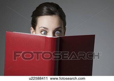 Cross-eyed Brunette and red book cover View Large Photo Image Stock Image - Cross-eyed Brunette and red book cover. Fotosearch