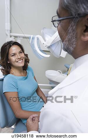 Dentist and patient View Large Photo Image Stock Photo - Dentist and patient. Fotosearch