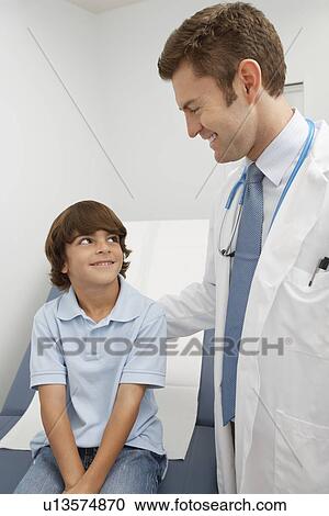 Doctor and young patient View Large Photo Image Stock Image - Doctor and young patient. Fotosearch