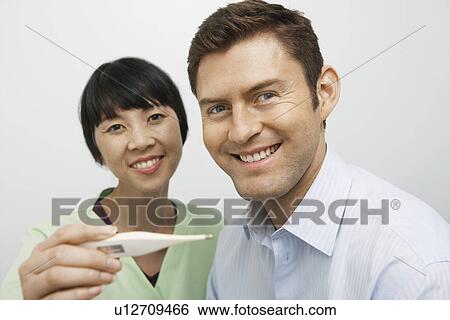 Doctor examining male patient in hospital, portrait View Large Photo Image Stock Photograph - Doctor examining male patient in hospital, portrait. Fotosearch