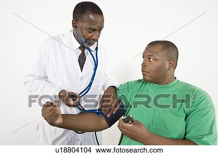 Doctor examining patient View Large Photo Image Picture - Doctor examining patient. Fotosearch