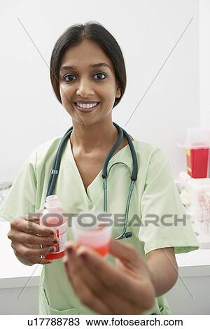 Doctor giving medicine View Large Photo Image Stock Image - Doctor giving medicine. Fotosearch