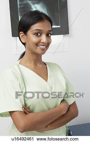 Doctor standing near x-ray in hospital, portrait View Large Photo Image Stock Image - Doctor standing near x-ray in hospital, portrait. Fotosearch