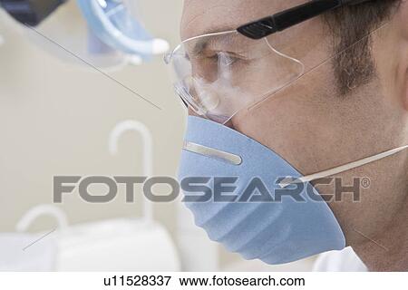 Doctor wearing mask View Large Photo Image Stock Photo - Doctor wearing mask. Fotosearch