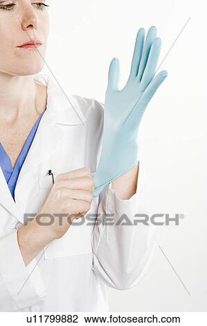 Doctor with rubber glove View Large Photo Image Stock Image - Doctor with rubber glove. Fotosearch