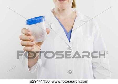 Doctor with sample pot, mid section View Large Photo Image Stock Image - Doctor with sample pot, mid section. Fotosearch