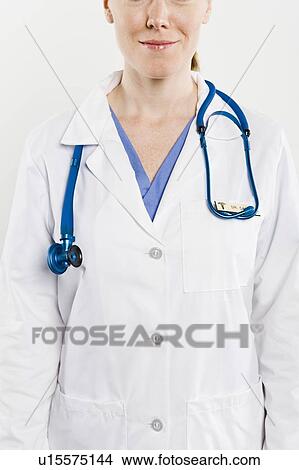 Doctor with stethoscope, mid section View Large Photo Image Picture - Doctor with stethoscope, mid section. Fotosearch