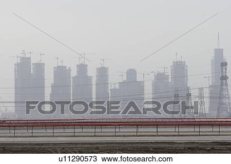 Dubai, UAE, partial view of Dubai's skyline from Nad Al Sheba Camel Racetrack View Large Photo Image Stock Image - Dubai, UAE, partial view of Dubai's skyline from Nad Al Sheba Camel Racetrack. Fotosearch
