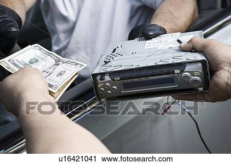 Stock Image - Exchange of car radio for cah. Fotosearch