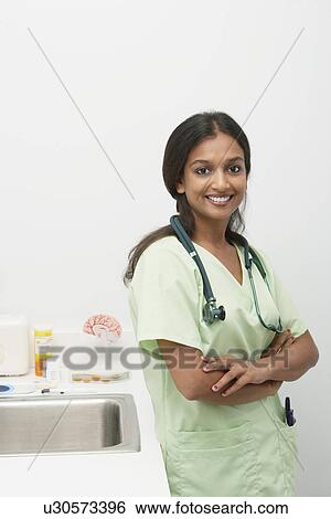 Female doctor, smiling View Large Photo Image Stock Photograph - Female doctor, smiling. Fotosearch