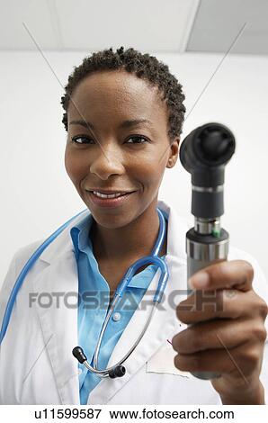 Female doctor threatning with thermometer View Large Photo Image Stock Photo - Female doctor threatning with thermometer. Fotosearch