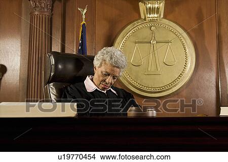 Picture - Female judge sleeping in court. Fotosearch