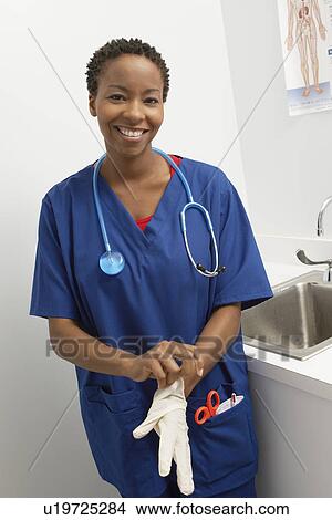 Picture - Female nurse in hospital, portrait. Fotosearch