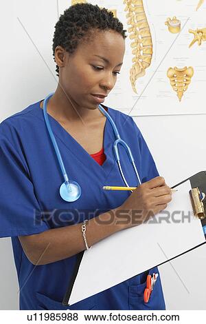 Stock Photo - Female nurse working in hospital. Fotosearch