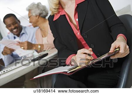 Picture - Financial Advisor Assisting Senior Couple. Fotosearch