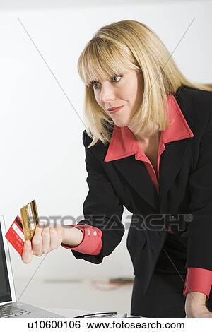 Stock Photograph - Financial Advisor Holding Credit Cards. Fotosearch
