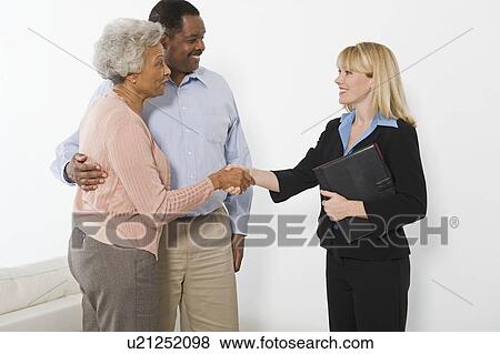 Stock Photo - Financial Advisor Meeting Senior Couple. Fotosearch