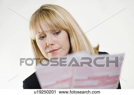 Financial Advisor Studying Paperwork View Large Photo Image Stock Image - Financial Advisor Studying Paperwork. Fotosearch