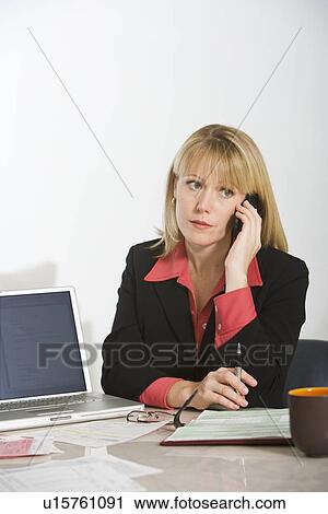 Stock Image - Financial Advisor Using Telephone. Fotosearch