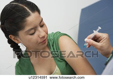 Girl having injection View Large Photo Image Stock Image - Girl having injection. Fotosearch