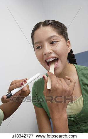 Girl having medical examination View Large Photo Image Stock Photo - Girl having medical examination. Fotosearch