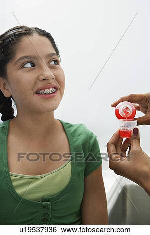 Girl waiting for medicine View Large Photo Image Stock Photograph - Girl waiting for medicine. Fotosearch
