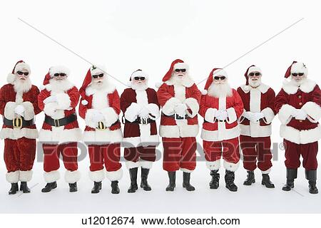Group of men dressed as Santa Claus wearing sunglasses View Large Photo Image Picture - Group of men dressed as Santa Claus wearing sunglasses. Fotosearch