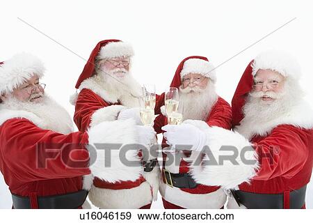 Stock Photo - Group of men dressed as Santa Claus toasting champagne. Fotosearch