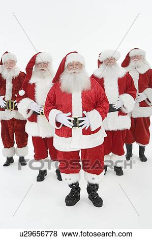 Stock Photo - Group of men dressed as Santa Claus. Fotosearch