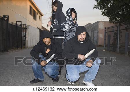 Group of young people posing with knives View Large Photo Image Stock Image - Group of young people posing with knives. Fotosearch