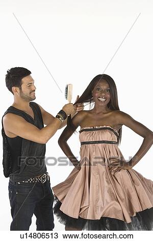 Hair stylist adjusts models hair View Large Photo Image Stock Image - Hair stylist adjusts models hair. Fotosearch