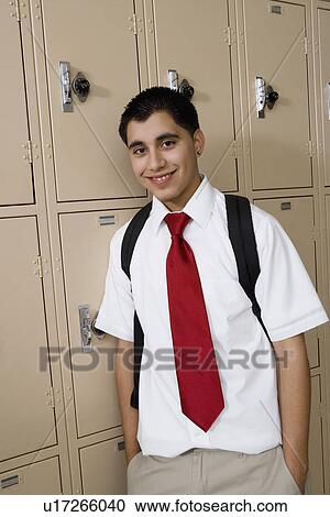 High School Boy Standing by Lockers View Large Photo Image Stock Image - High School Boy Standing by Lockers. Fotosearch