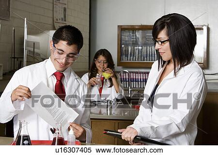 Stock Photography - High School Student Holding Curriculum Paper. Fotosearch