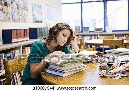 High School Student Reading in Library View Large Photo Image Picture - High School Student Reading in Library. Fotosearch