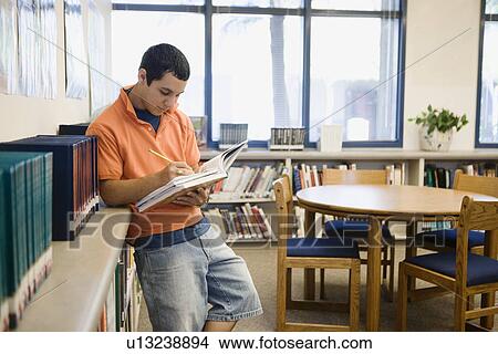 High School Student Studying in Library View Large Photo Image Picture - High School Student Studying in Library. Fotosearch