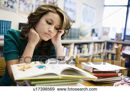 Stock Photo - High School Student Studying in Library. Fotosearch