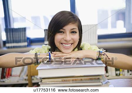 High School Student with a Stack of Books View Large Photo Image Stock Photograph - High School Student with a Stack of Books. Fotosearch
